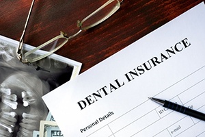 A dental insurance form on a desk