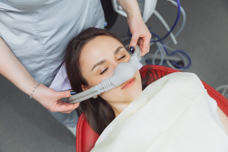 someone peacefully receiving nitrous oxide sedation