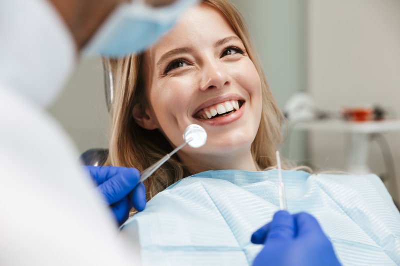 Woman smiles at dentist